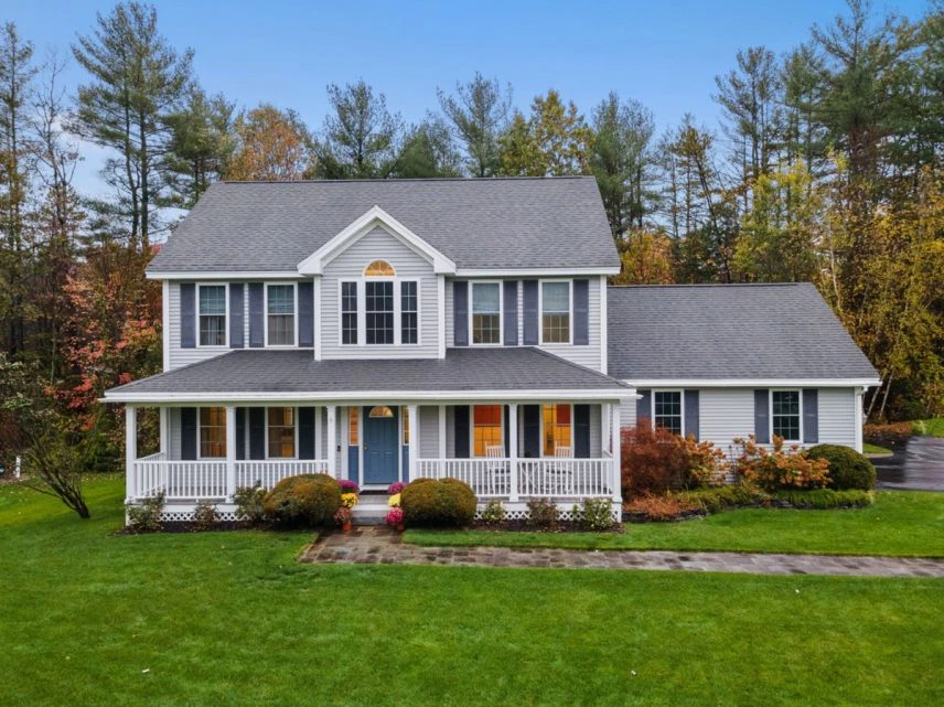 house with autumnal trees